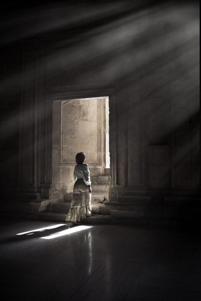 Woman walks through doorway of the Alhambra on an Andalusia photo workshop